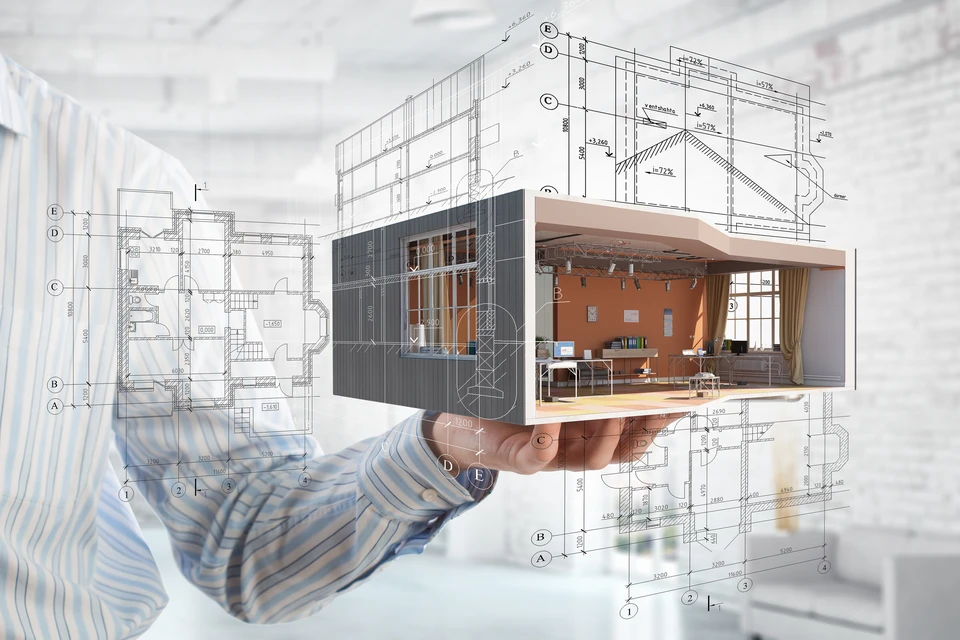 Une personne en chemise rayée présente une maquette architecturale 3D d'un intérieur moderne avec cuisine équipée, salon et bureau