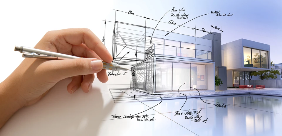 Main d'architecte tenant un crayon dessine les plans techniques d'une maison moderne contemporaine